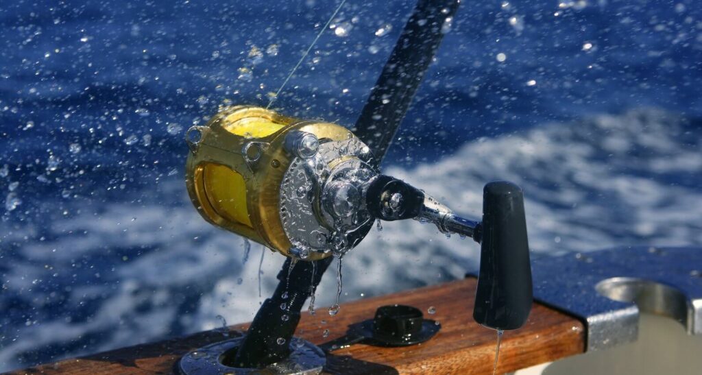 deep sea fishing reel in sea spray